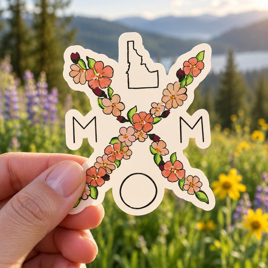 Idaho Mom Bouquet sticker held outdoors
